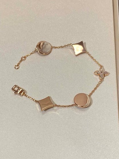 [Max Jewelry ]STAR AND SUN 5 MOTIF MOP PINK GOLD BRACELET