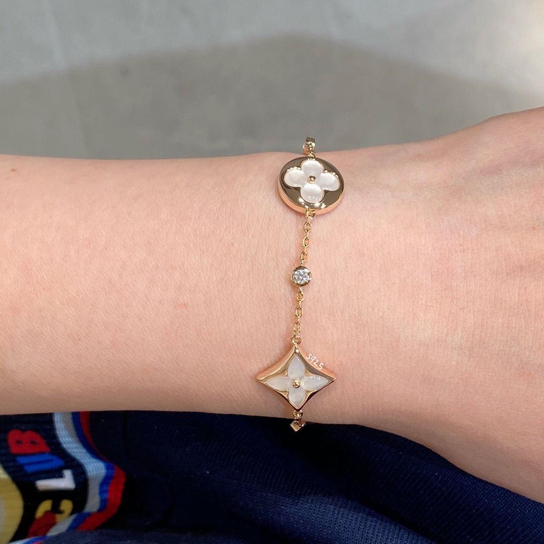 [Max Jewelry ]STAR AND SUN 4 MOTIF WHITE MOP PINK GOLD BRACELET