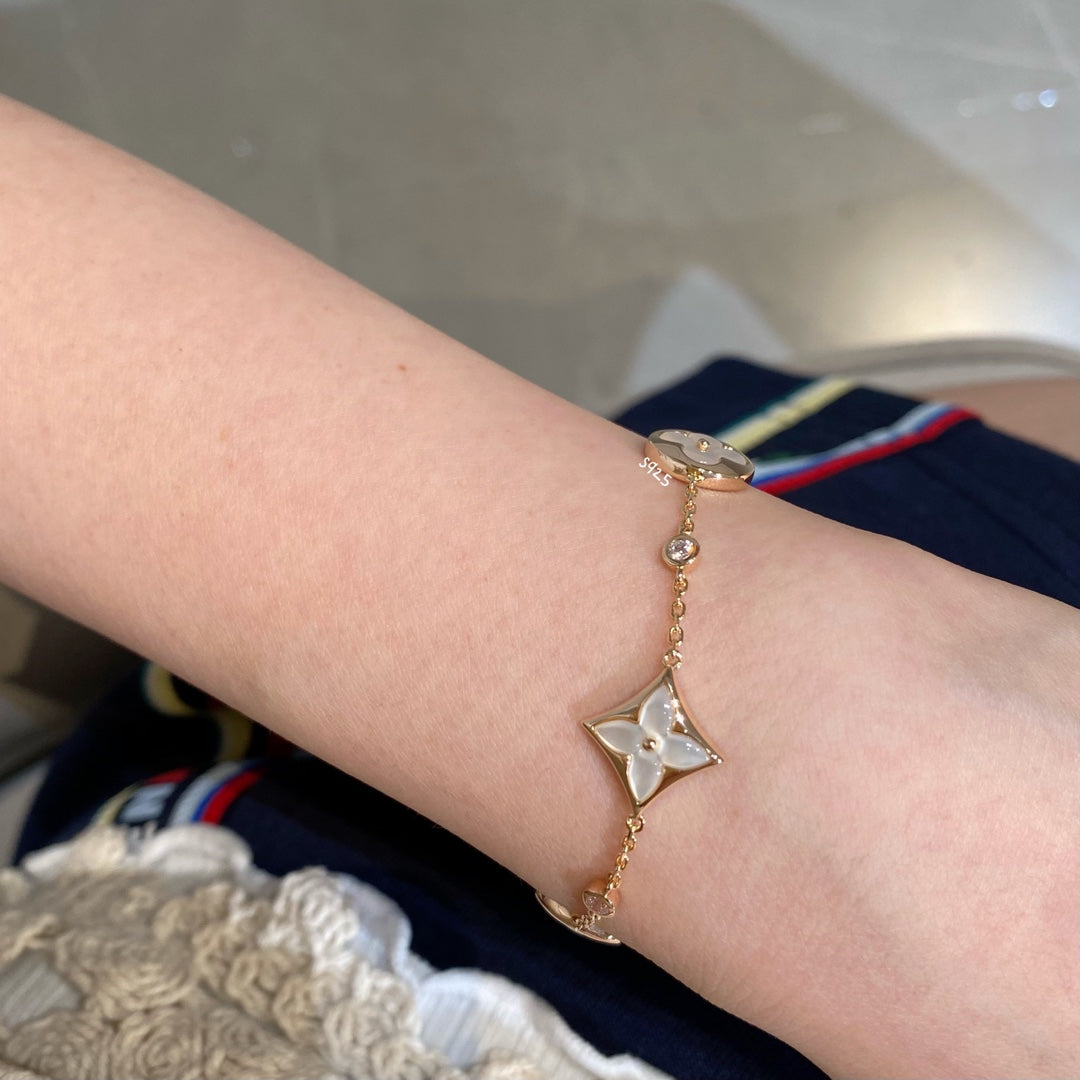 [Max Jewelry ]STAR AND SUN 4 MOTIF WHITE MOP PINK GOLD BRACELET